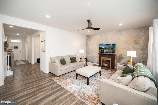 living room featuring dark hardwood / wood-style floors and ceiling fan