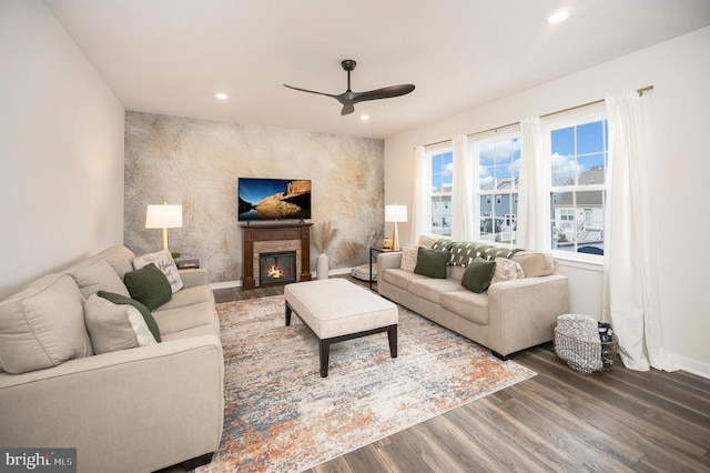 living room with hardwood / wood-style floors and ceiling fan