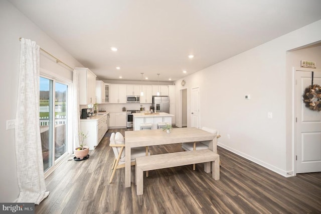 dining room featuring hardwood / wood-style floors and sink