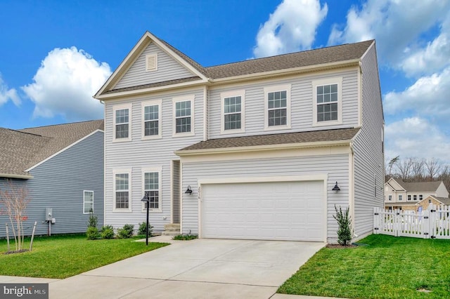 view of front of home with a front yard and a garage