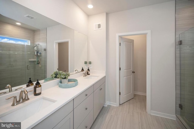 bathroom with vanity and an enclosed shower