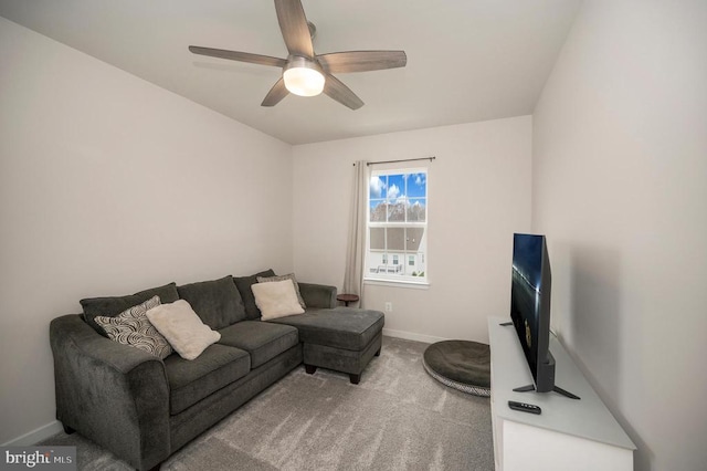 carpeted living room featuring ceiling fan