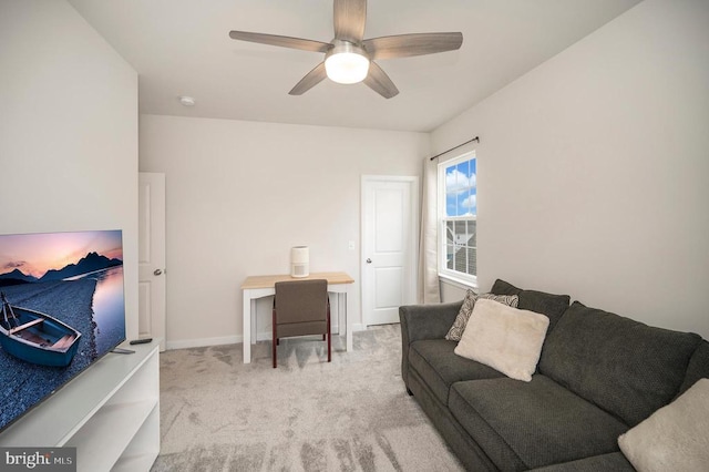 carpeted living room featuring ceiling fan