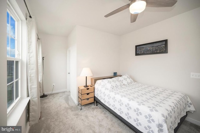 carpeted bedroom with ceiling fan