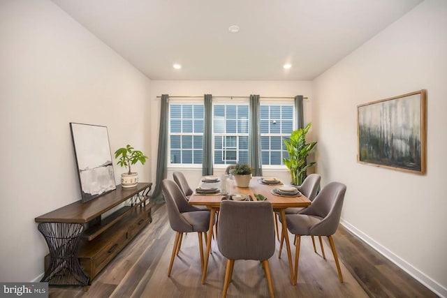 dining area featuring dark hardwood / wood-style flooring