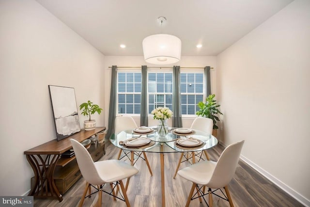 dining area with wood-type flooring