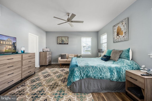 bedroom featuring ceiling fan and dark wood-type flooring