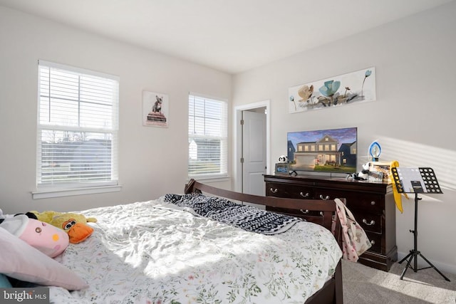 bedroom with light colored carpet