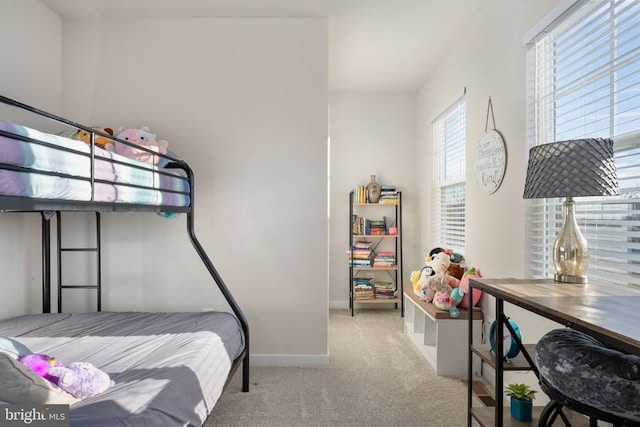 bedroom with light colored carpet