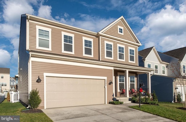 view of front facade featuring a garage and a front lawn