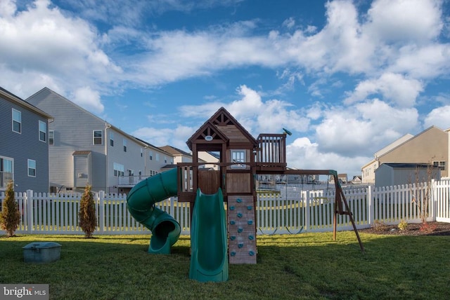 view of jungle gym with a lawn