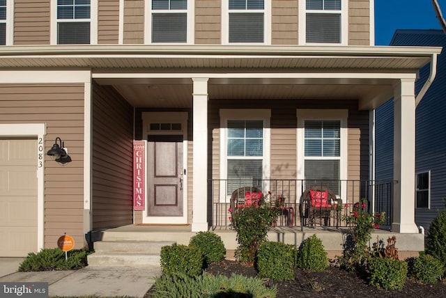 doorway to property with a porch