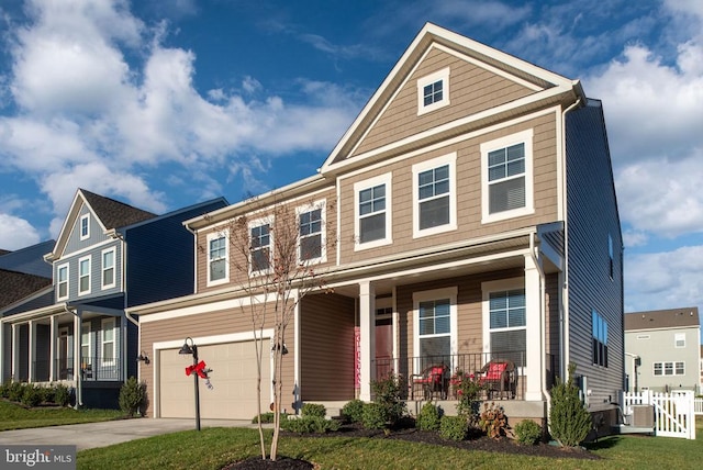 view of front facade featuring a porch, a garage, and a front yard