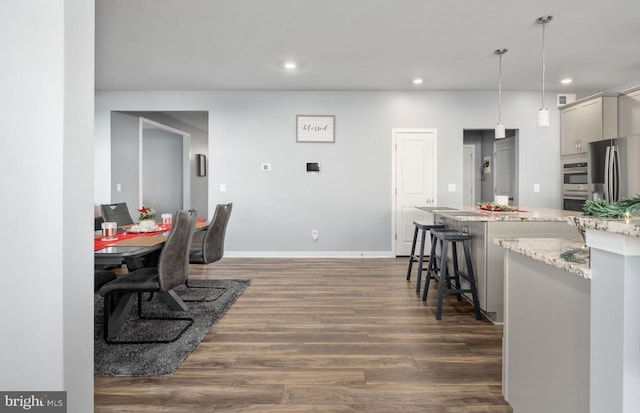 dining room with dark wood-type flooring