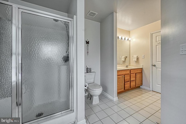 bathroom with tile patterned floors, vanity, toilet, and an enclosed shower