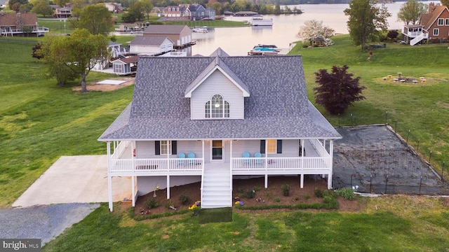 birds eye view of property featuring a water view