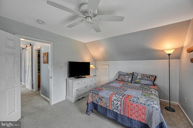 carpeted bedroom with ceiling fan and vaulted ceiling