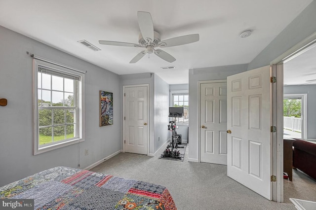 carpeted bedroom with ceiling fan