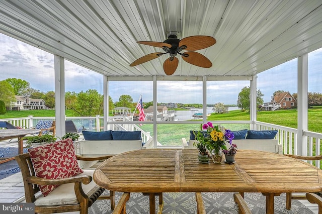 sunroom with ceiling fan and plenty of natural light