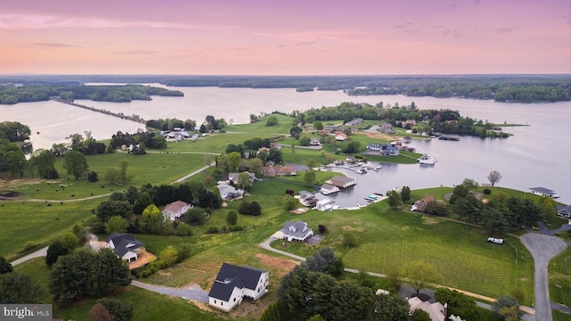 aerial view at dusk with a water view