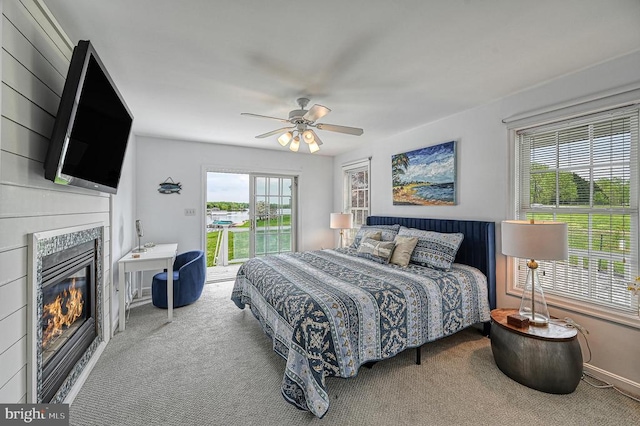 carpeted bedroom with ceiling fan