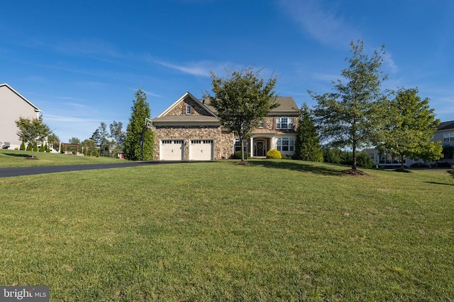 view of front of home featuring a garage and a front yard