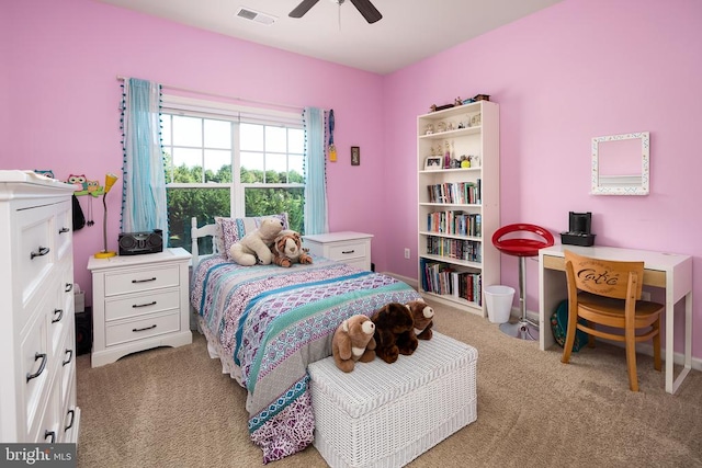 bedroom featuring ceiling fan and light carpet