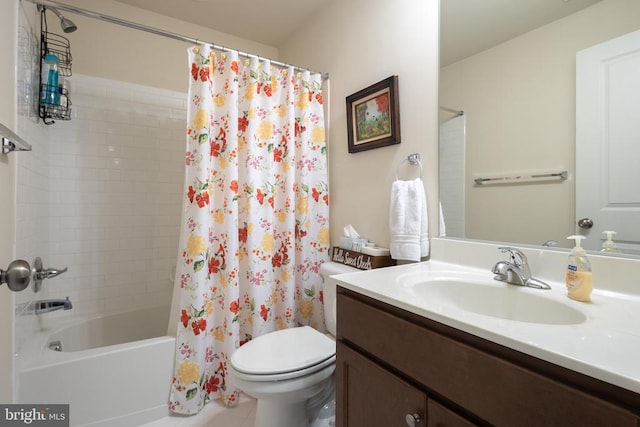 full bathroom featuring shower / bath combination with curtain, vanity, and toilet