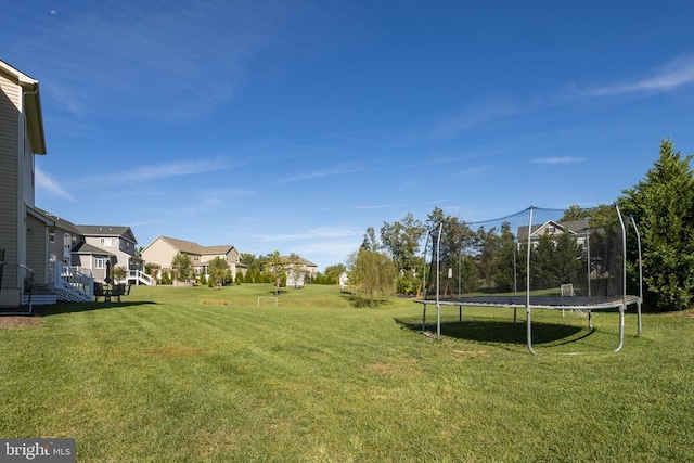 view of yard with a trampoline