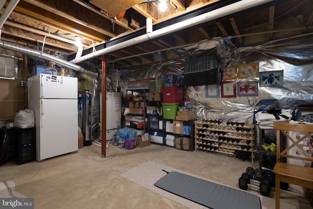 basement featuring white fridge and gas water heater