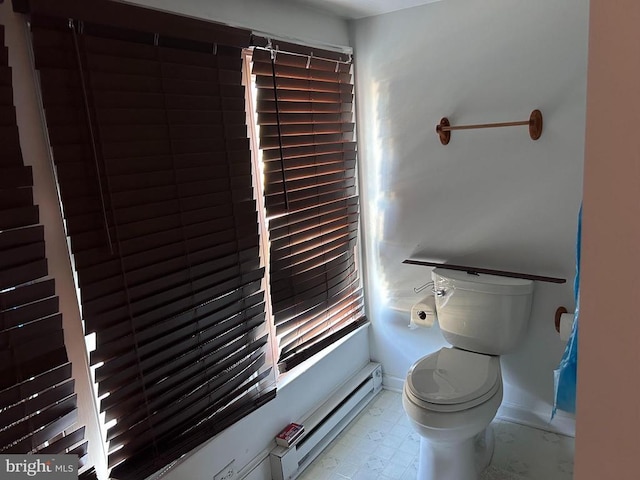 bathroom featuring a baseboard radiator and toilet