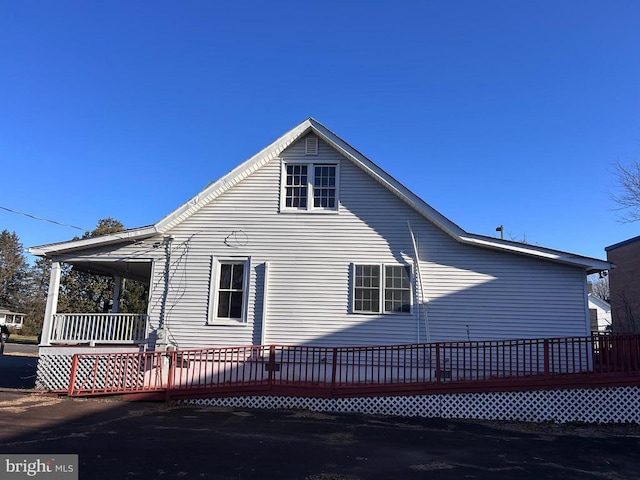 view of side of home featuring a deck