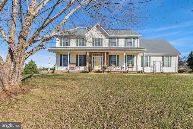 colonial inspired home featuring a front lawn and a porch