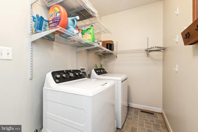 laundry area with independent washer and dryer