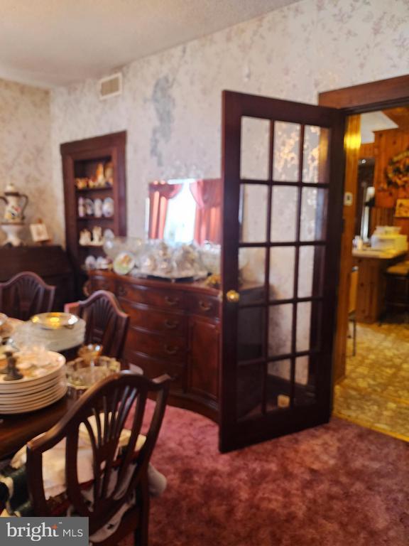 dining space featuring carpet floors