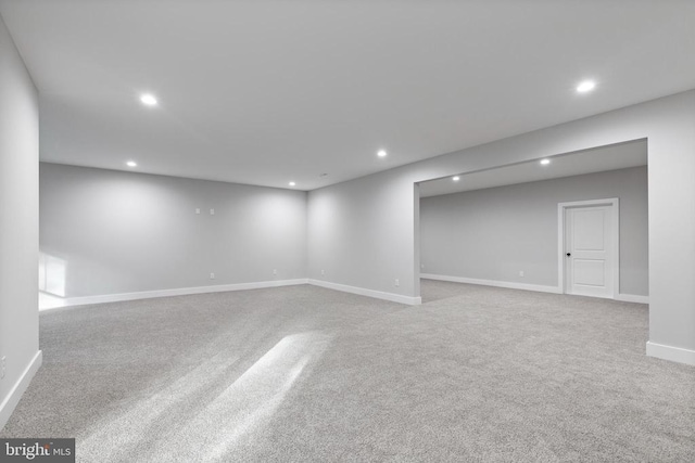 basement with light colored carpet