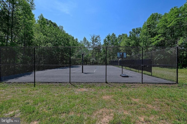 view of basketball court featuring a yard