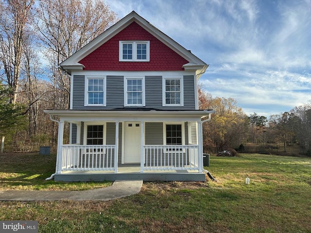 view of front of home with a front lawn and a porch