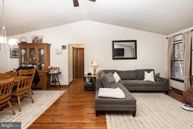 living room with wood-type flooring and lofted ceiling