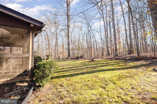 view of yard featuring a sunroom