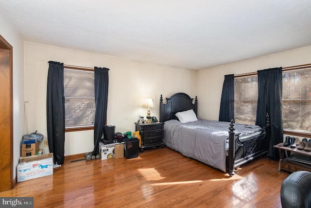 bedroom with hardwood / wood-style flooring