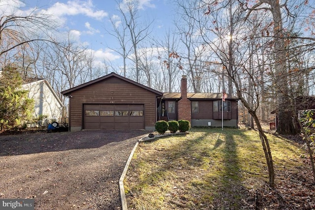 ranch-style house featuring a garage