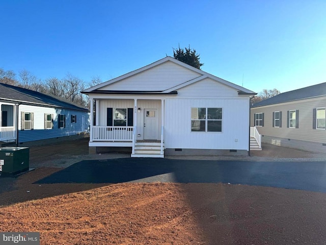 view of front of home with central air condition unit and a porch