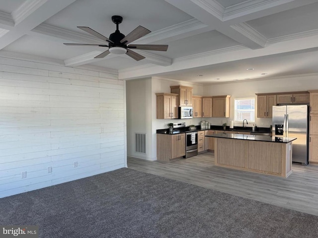 kitchen with beam ceiling, crown molding, stainless steel appliances, and coffered ceiling