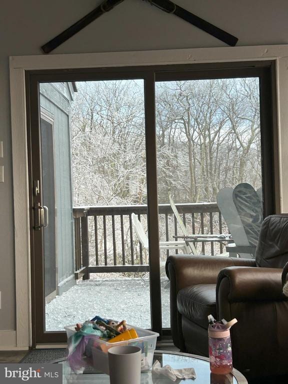 view of snow covered back of property