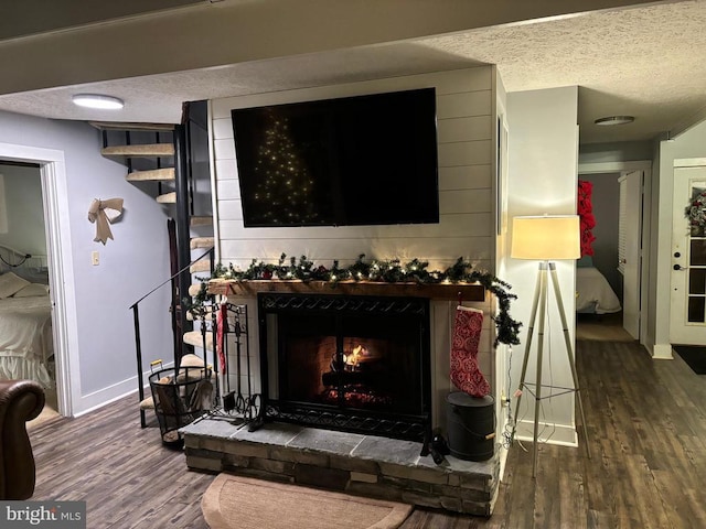 interior details featuring hardwood / wood-style floors and a textured ceiling