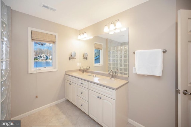 bathroom featuring tile patterned floors, plenty of natural light, and vanity