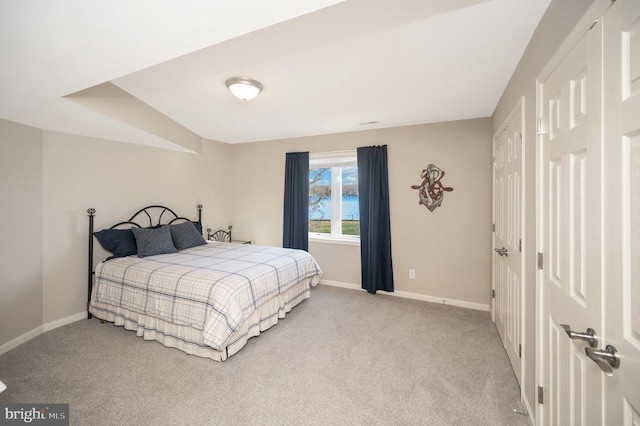 bedroom featuring light colored carpet