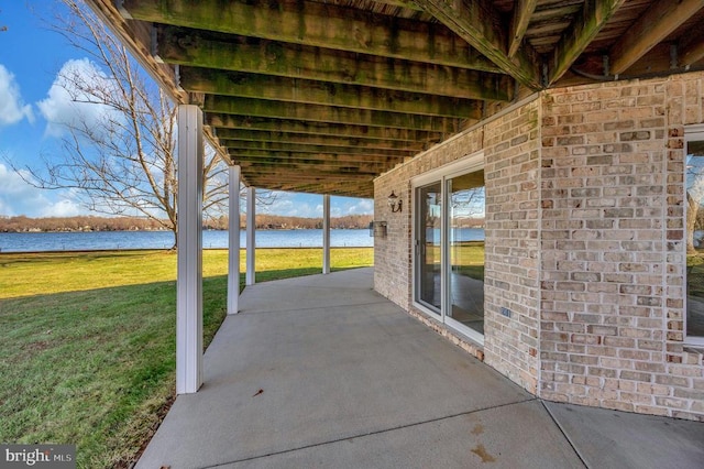 view of patio / terrace with a water view