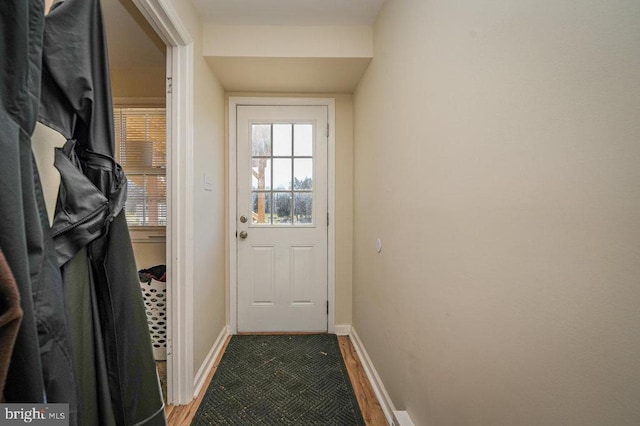 doorway with hardwood / wood-style floors